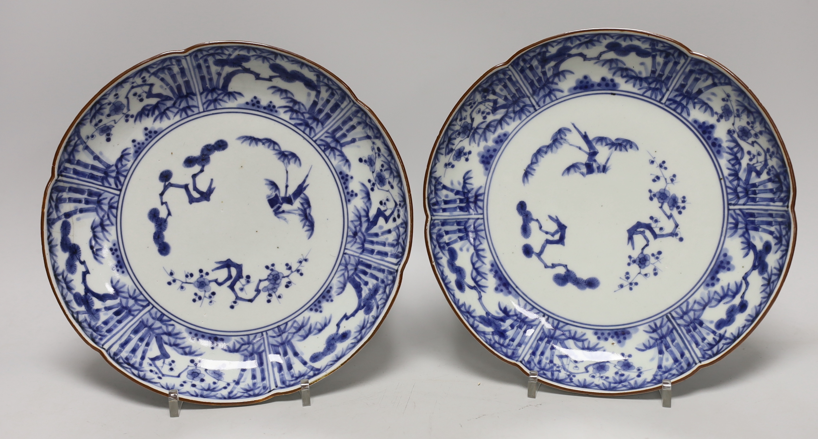 Three Japanese blue and white Arita dishes, largest 25cm